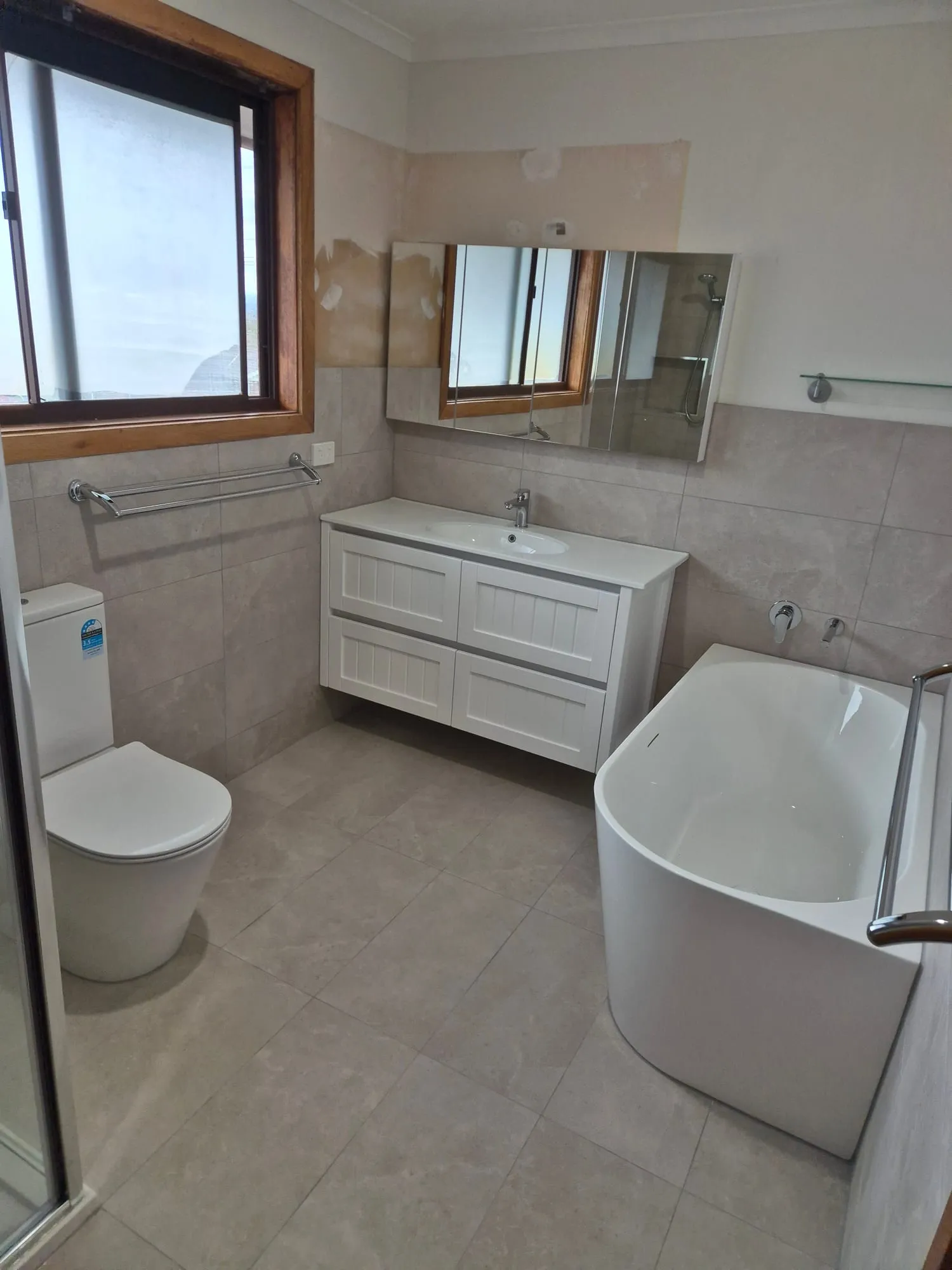The same room from the shower, showing the vanity and bath